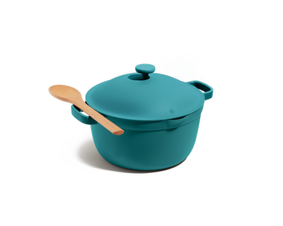 The Perfect Pot in teal, featuring an 8-in-1 nonstick design with lid and side handles, is pictured on a white background with a wooden spoon resting on top.