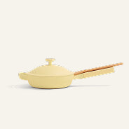 The Ceramic Nonstick Always Pan 8.5” with a lid and wooden handle is displayed in a side profile against a plain, light background—this multifunctional yellow pan offers safe, non-toxic cooking for everyday meals.