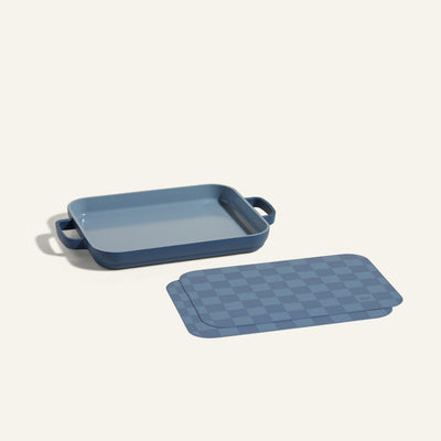 A Mini Griddle Pan is displayed beside matching Mini Oven Mats on a plain light background.