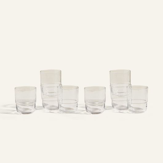 Six clear, empty Short Night + Day Glasses are arranged in two rows on a light background; three are stacked in pairs and three stand alone, highlighting these versatile handmade tumblers perfect for any occasion.